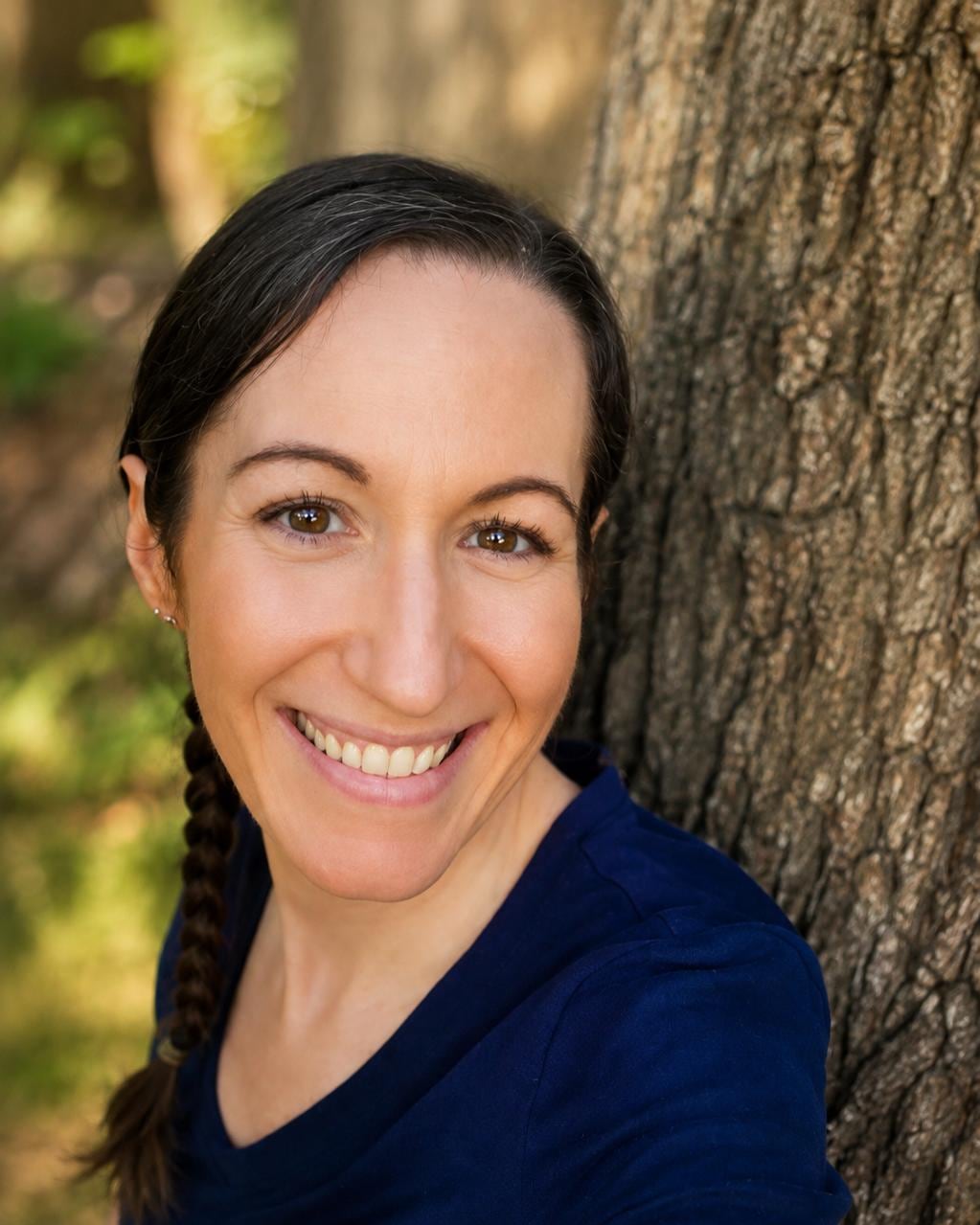 Portrait of Dawn, co-host of Rise & Restore Retreats, in warm desert light